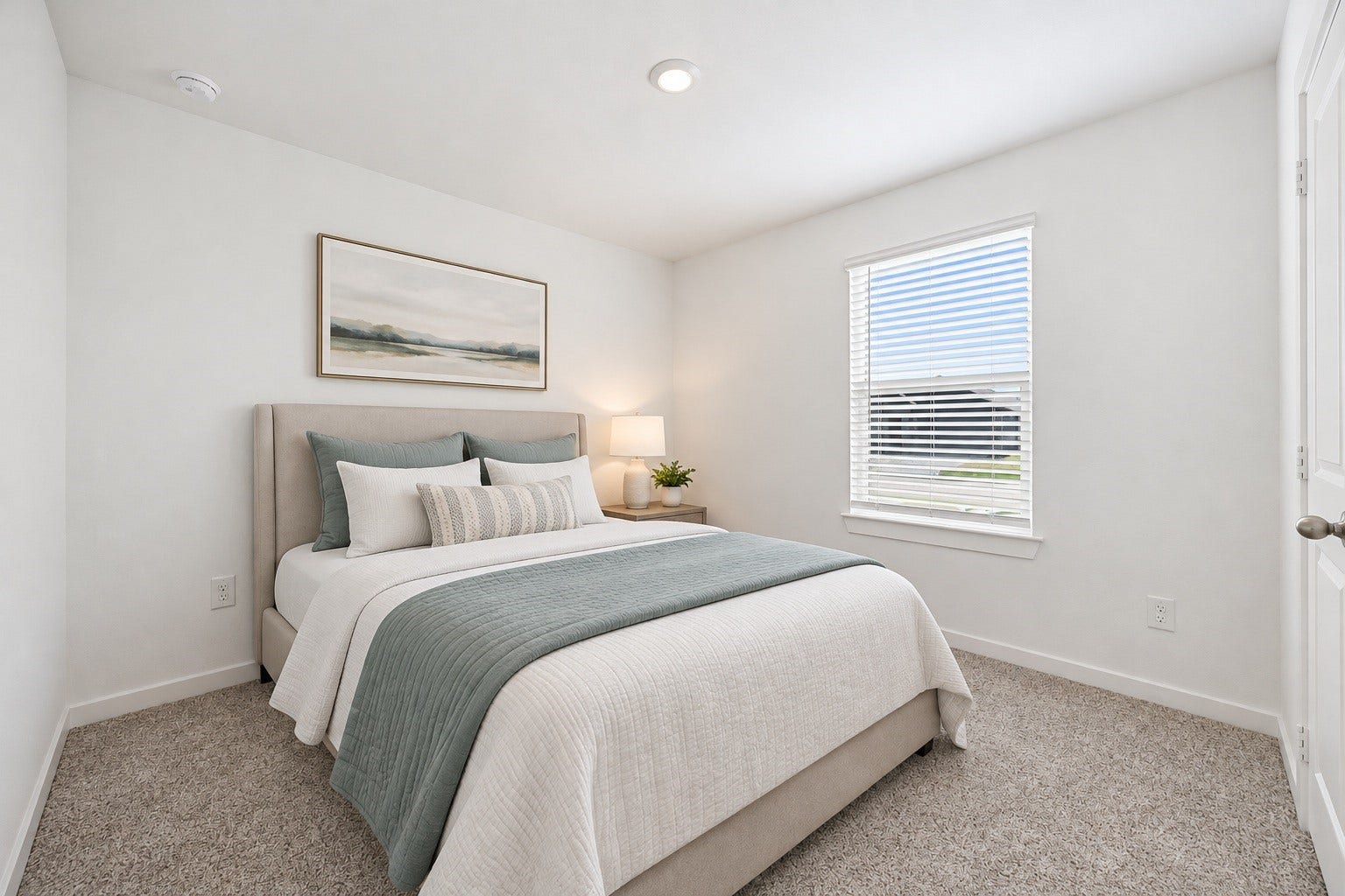 A secondary bedroom offers a bright, versatile space with plush carpet and a large window. Virtually staged.