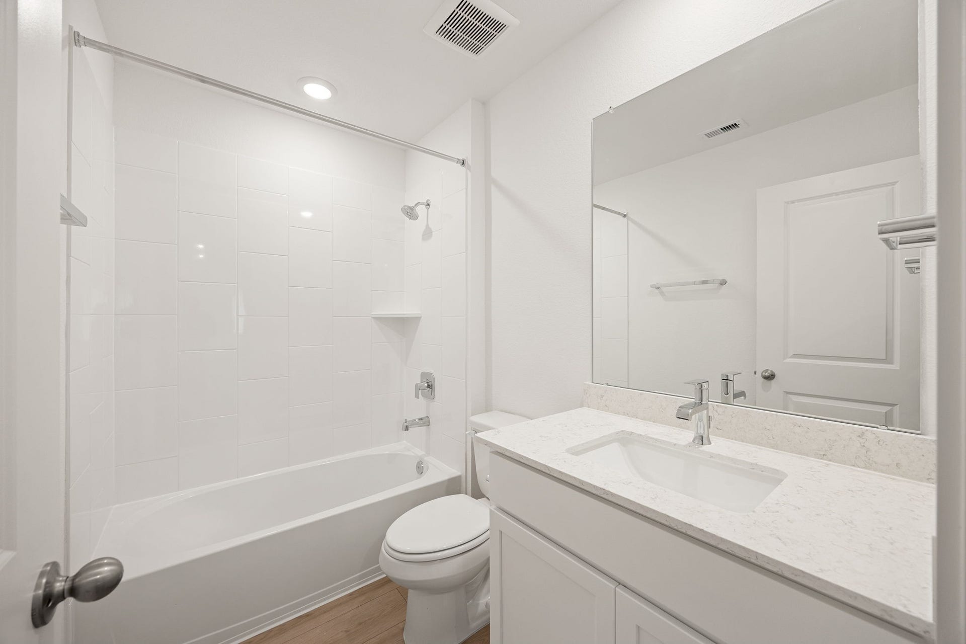 Another secondary bathroom offers a tub/shower combo and a clean, updated vanity.