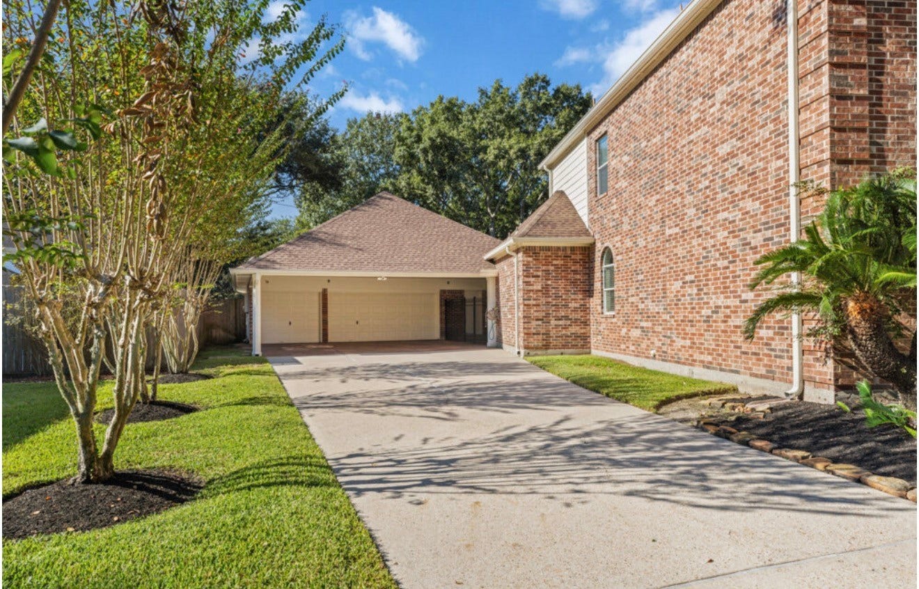 2831 Hazy Hillside Court, Houston, TX 77345 Long double wide driveway with covered area