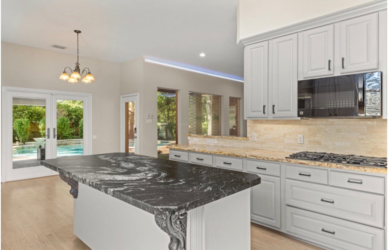 2831 Hazy Hillside Court, Houston, TX 77345 Gravite and slate countertops with a gas range