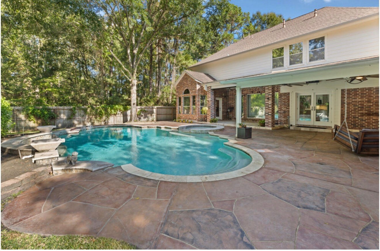 2831 Hazy Hillside Court, Houston, TX 77345 Lush trees and foliage keep the pool from being too hot in the summer