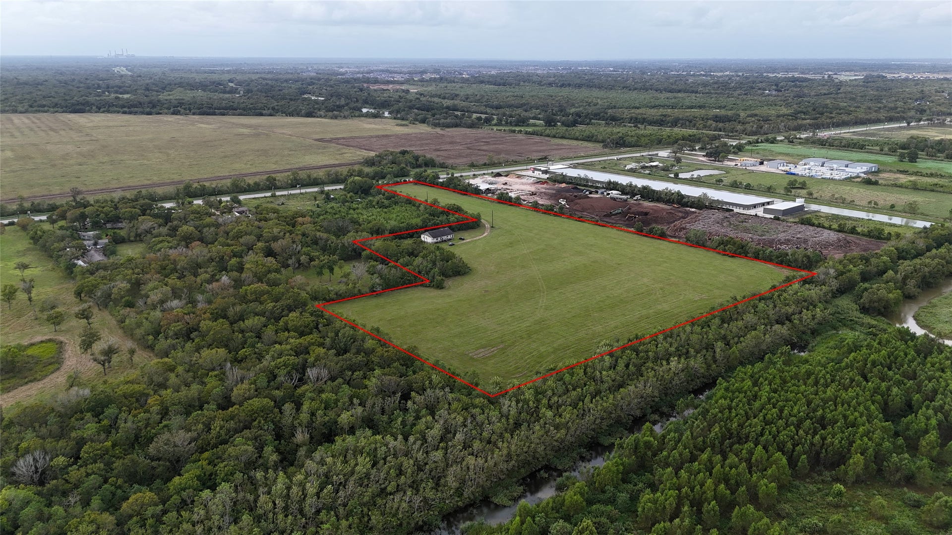 9621 Fm 521 Road, Rosharon, TX 77583 This expansive 17.286-acre tract features mostly flat, cleared land with minimal tree coverage, offering a substantial open footprint for future development.