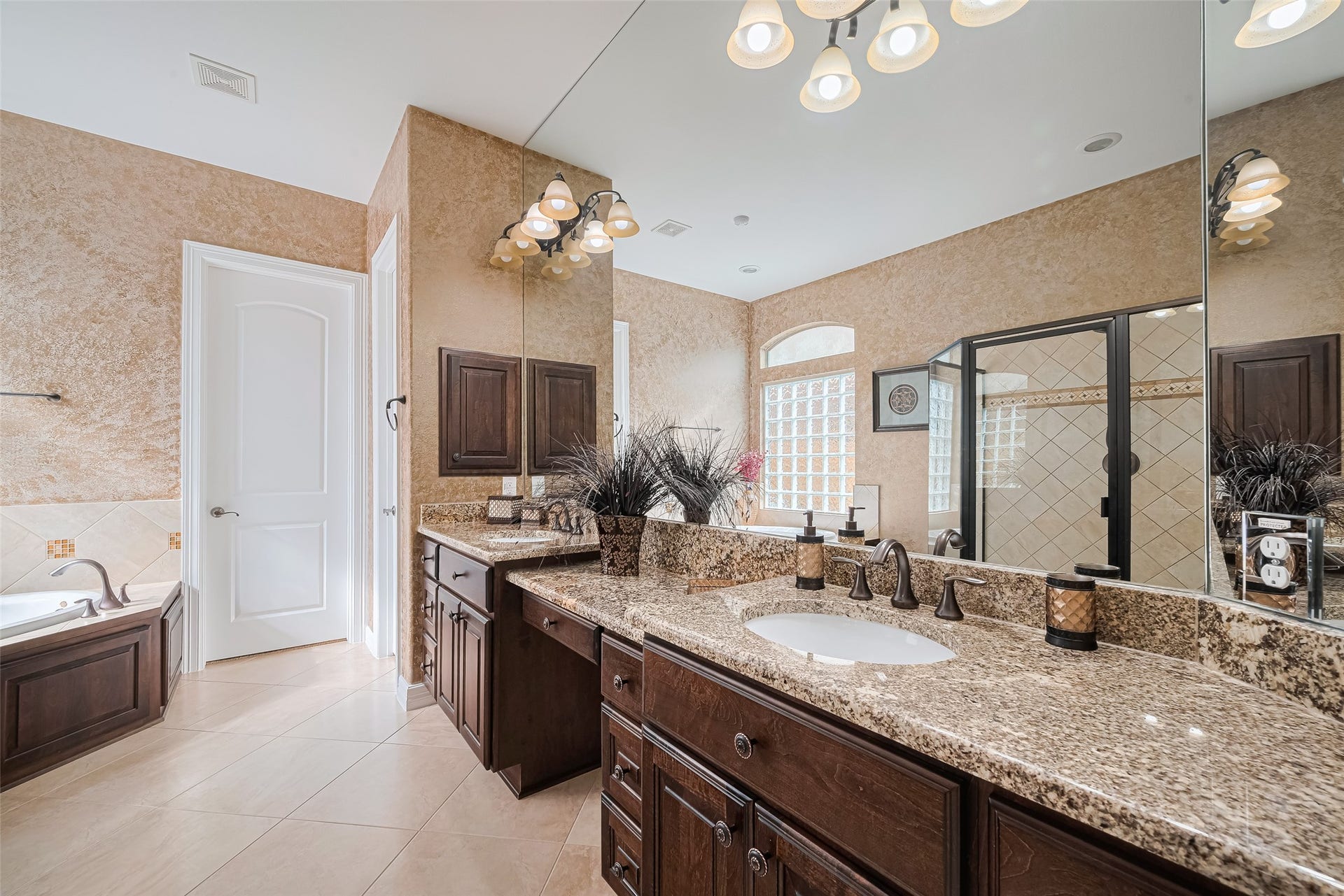 4722 Burclare Court, Sugar Land, TX 77479 Spacious primary bathroom featuring an extended granite vanity, abundant cabinetry, oversized mirrors, and a separate walk-in shower.
