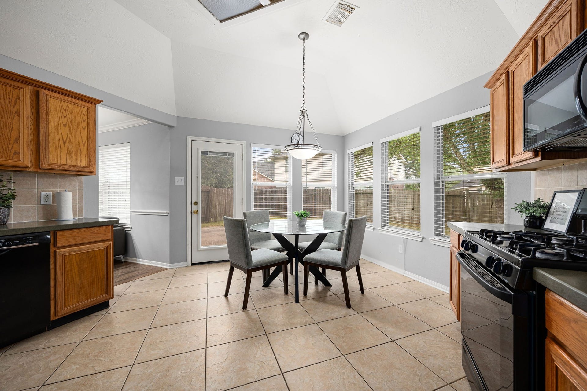 4807 Lake Wichita Lane, Richmond, TX 77407 Breakfast area with multiple windows and a back door leading straight to the patio.