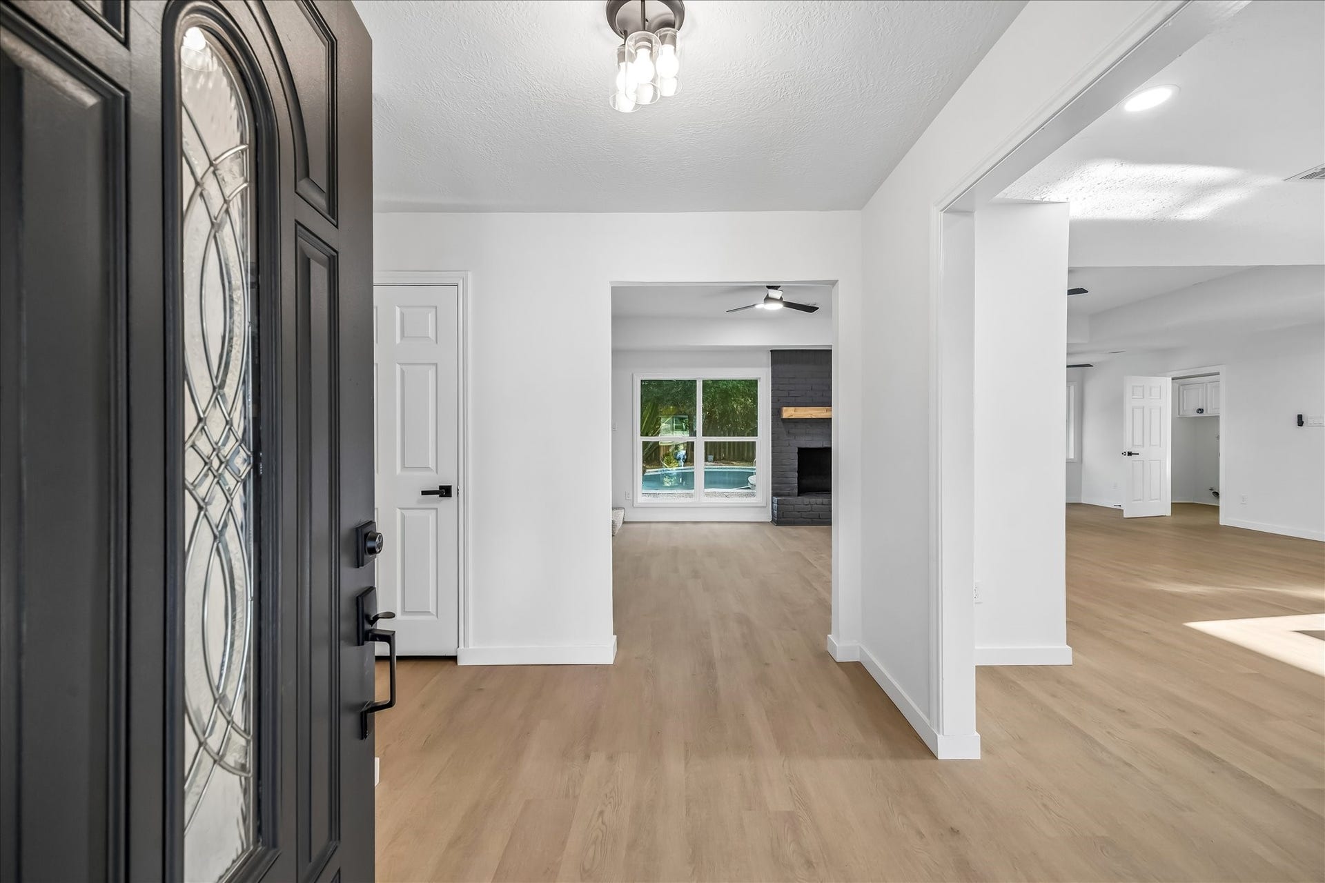 3430 Sycamore Shadows Drive, Kingwood, TX 77339 Foyer view of open floor plan. Family room in front and dining on right