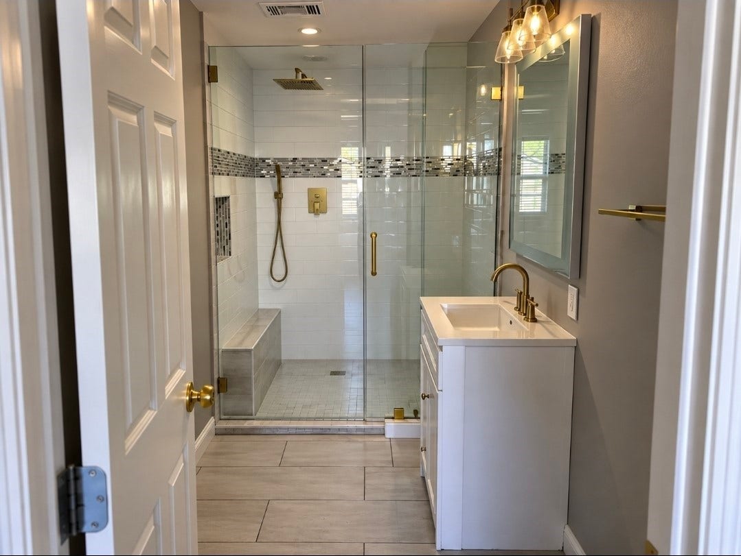 7929 Talton Street, Houston, TX 77028 Modern bathroom featuring a spacious glass-enclosed shower with stylish tile accents and a sleek vanity with gold fixtures for a touch of elegance.