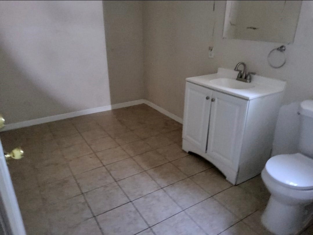 7929 Talton Street, Houston, TX 77028 Spacious bathroom featuring a modern vanity, tiled flooring, and sleek fixtures, offering a clean and functional space.