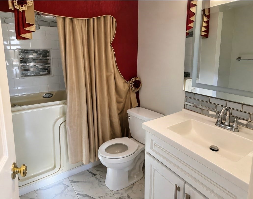 7929 Talton Street, Houston, TX 77028 Charming bathroom featuring a modern vanity with sleek fixtures, an elegant walk-in tub, and stylish tile accents for a touch of luxury.