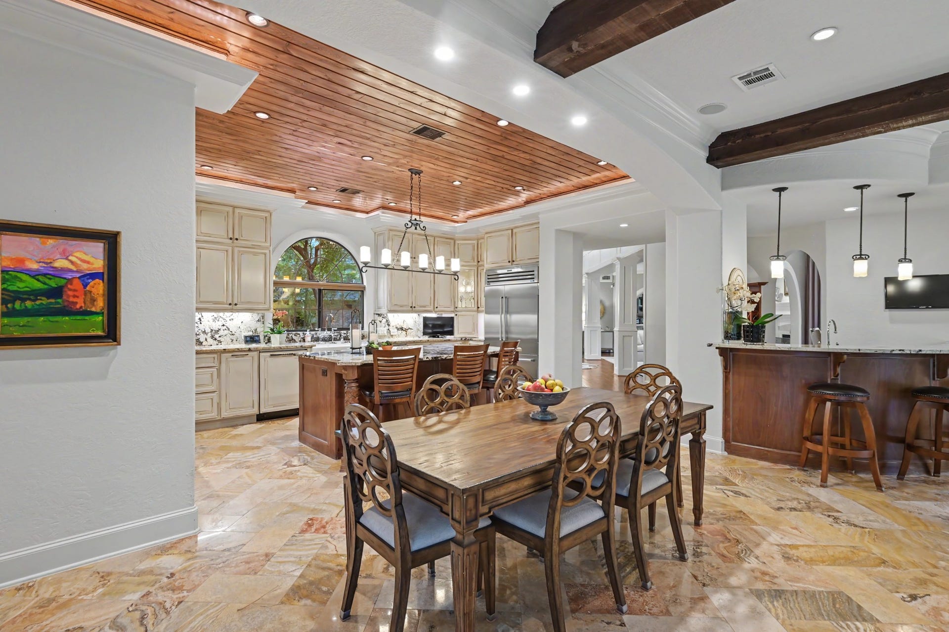 Breakfast table that seamlessly flows from the kitchen into the living room.