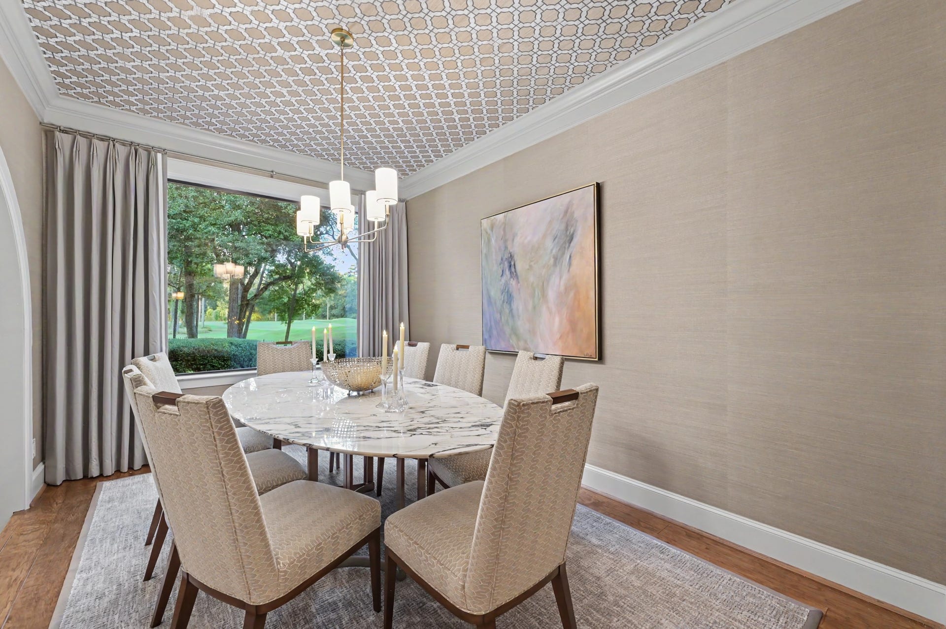 Elegant formal dining room that overlooks the serene golf course views.