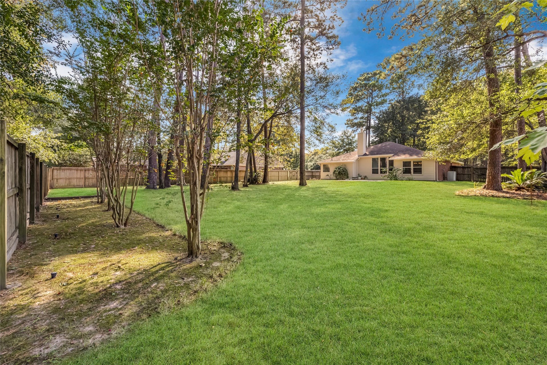914 Mesquite Drive, Magnolia, TX 77354 Huge, private lot with such potential! Perhaps a play structure, pool, garden and/or shop are in your future.