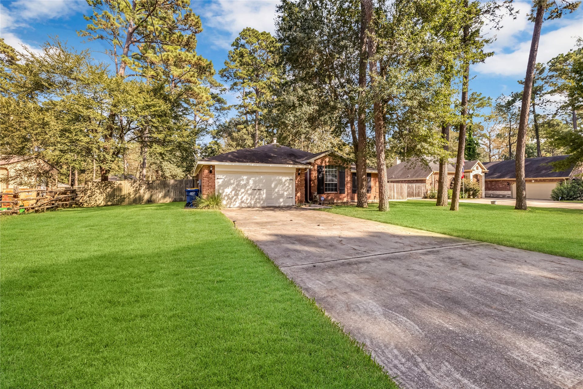 914 Mesquite Drive, Magnolia, TX 77354 There's a large driveway for your guests and decorative shutters that add to the curb appeal