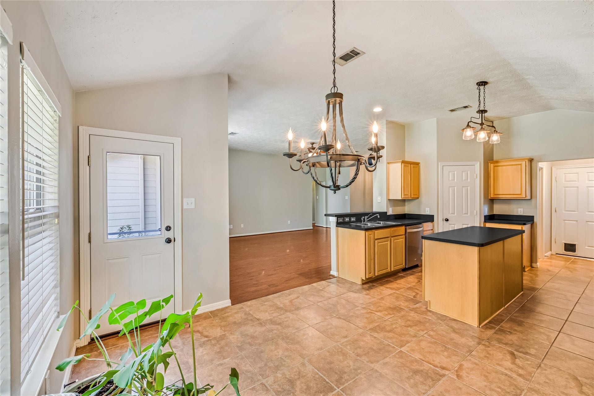 914 Mesquite Drive, Magnolia, TX 77354 Dining room has large windows for wonderful natural light and access to the back yard. Perfectly situated for both private meals and entertaining.