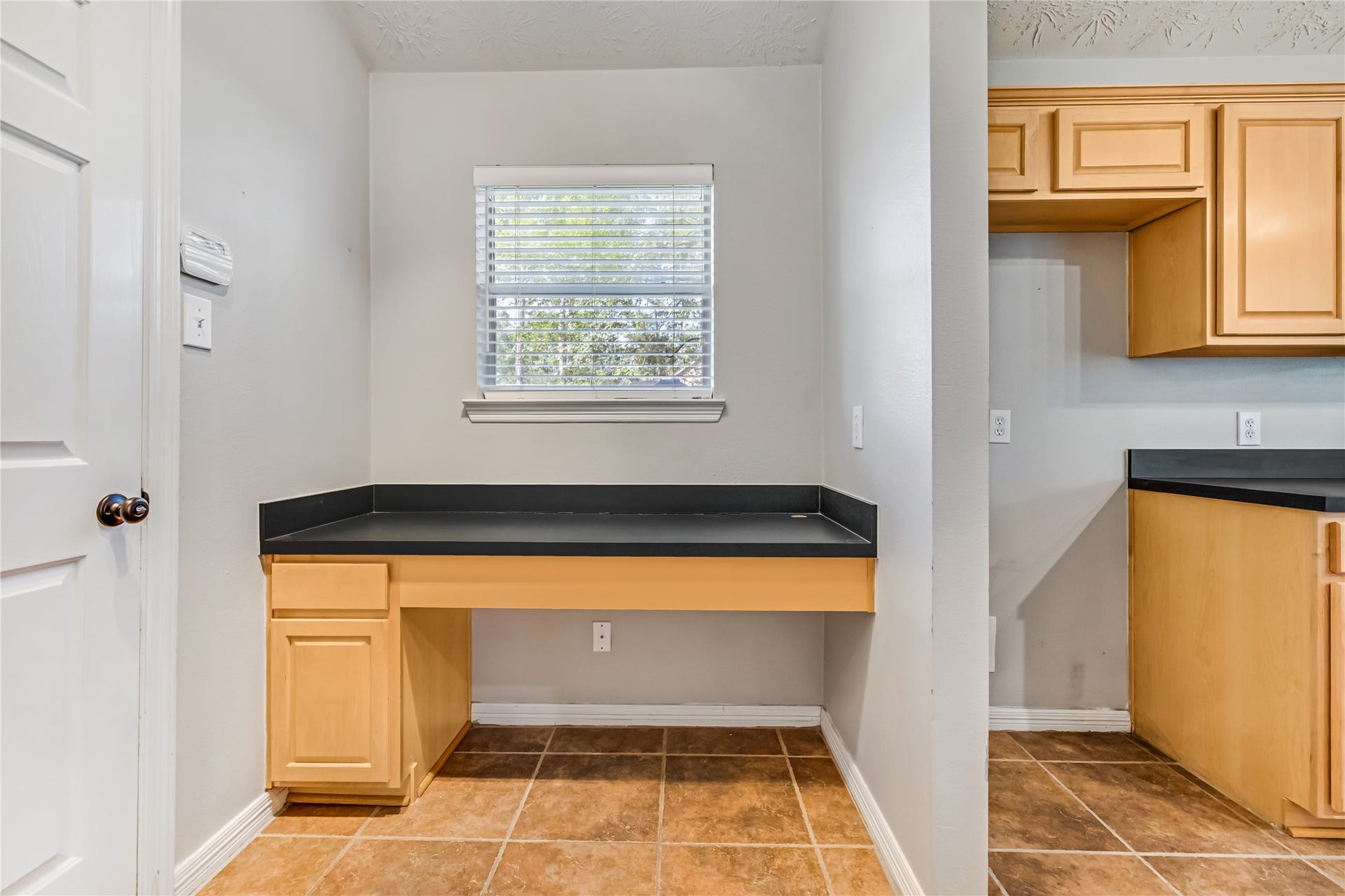 914 Mesquite Drive, Magnolia, TX 77354 Through the kitchen is an office space or mudroom and garage access.