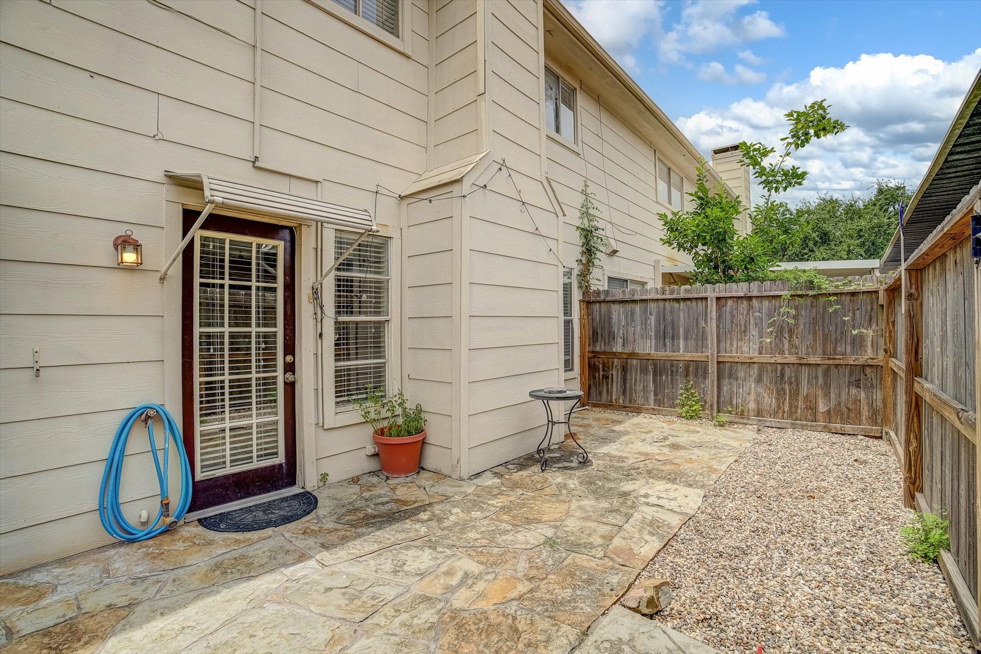794 Thicket Lane, Houston, TX 77079 Exterior patio with access to the house as well as carport.