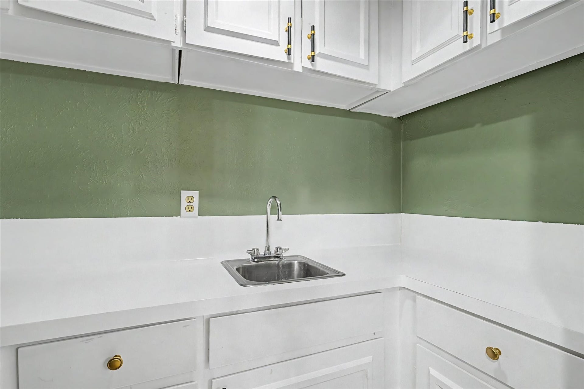 794 Thicket Lane, Houston, TX 77079 Built-in cabinetry with countertop, sink, and ample storage.