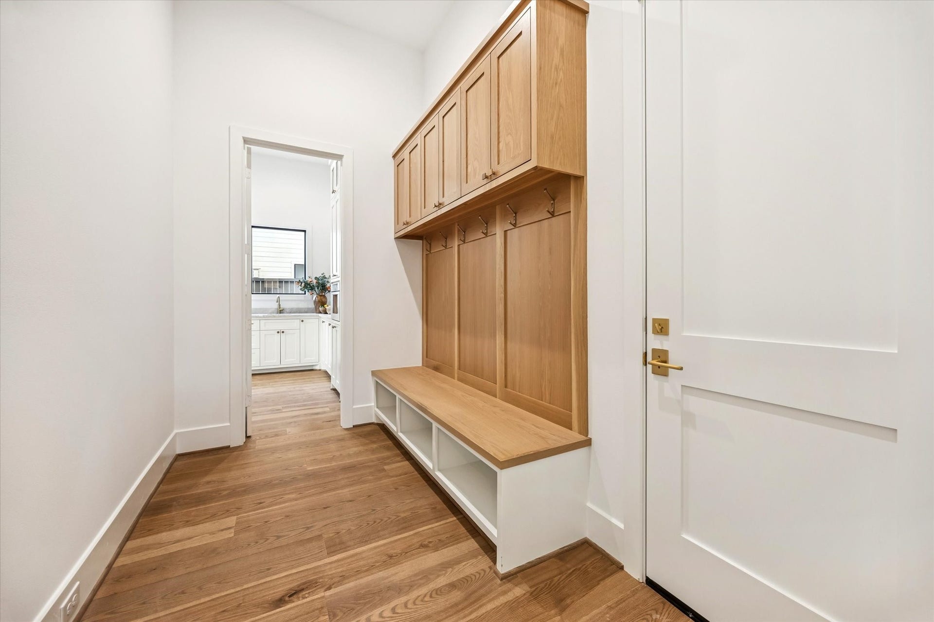 320 W 32nd Street, Houston, TX 77018 Mudroom creates an organized transition from garage to home with built in cabinetry, hooks, and bench seating. Thoughtful storage keeps everyday items tucked away while maintaining a clean, streamlined entry point.**Previous build by Arch Angelo**