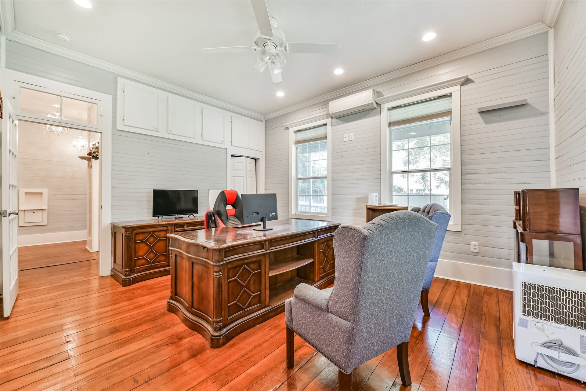 503 W Blum Street, Alvin, TX 77511 Flexible main-level room currently configured as an office with beautiful original hardwood floors.