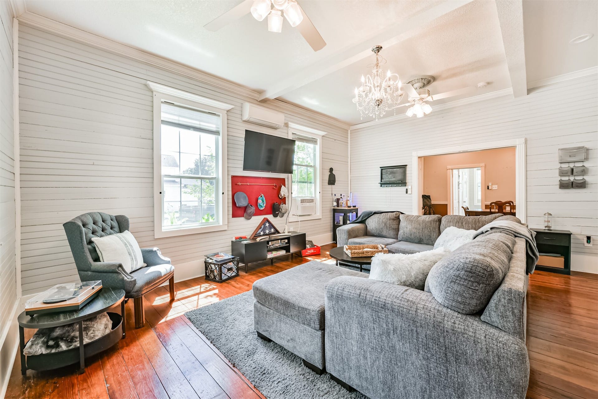 503 W Blum Street, Alvin, TX 77511 Spacious living area pairs 10' ceilings with beautiful original flooring and natural light.