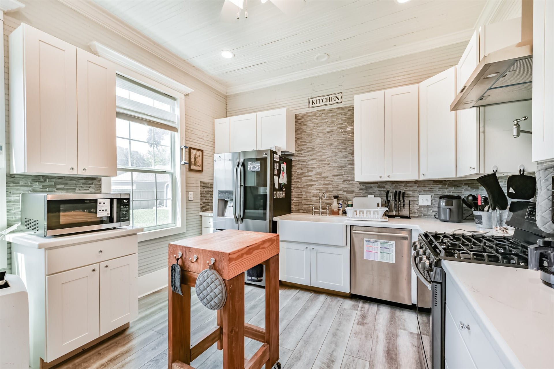 503 W Blum Street, Alvin, TX 77511 Updated kitchen provides modern functionality while complementing the homes historic character.