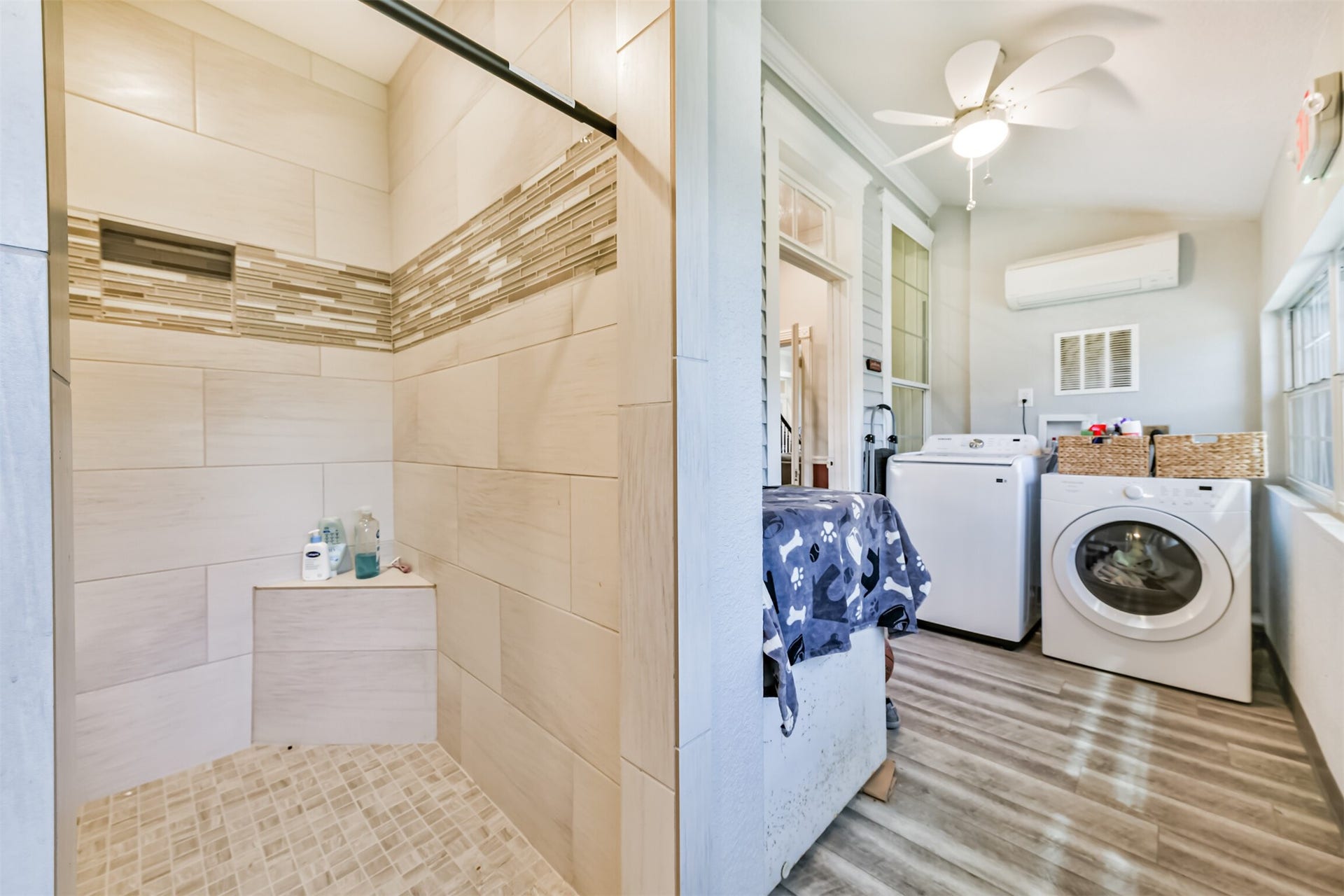 503 W Blum Street, Alvin, TX 77511 Convenient utility area with laundry, storage and shower.