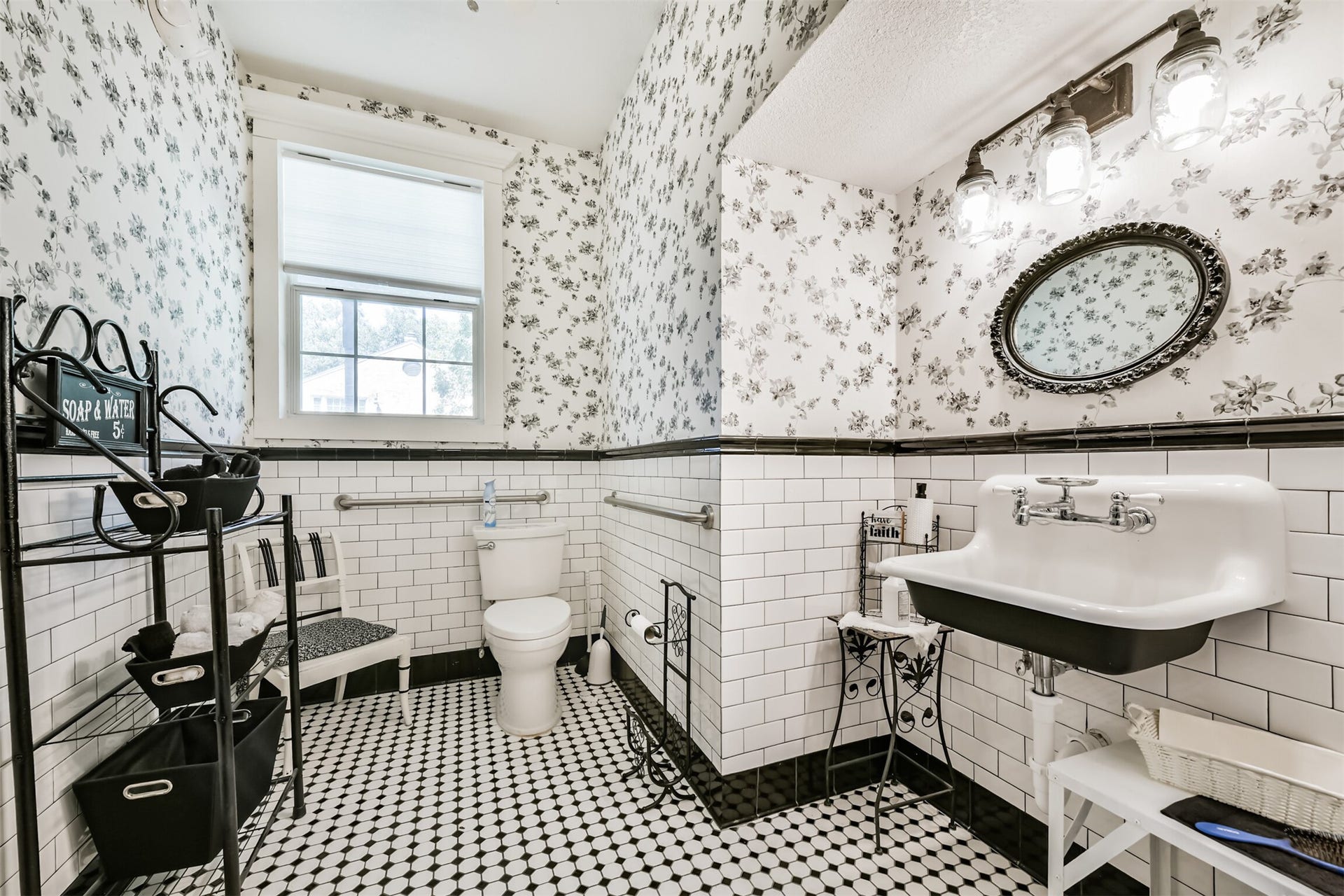 503 W Blum Street, Alvin, TX 77511 Updated main-level half bath with charming vintage-inspired finishes.