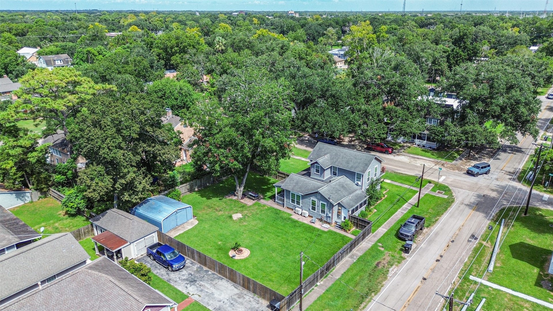 503 W Blum Street, Alvin, TX 77511 Aerial view showcasing the home, expansive lawn and prominent corner location.