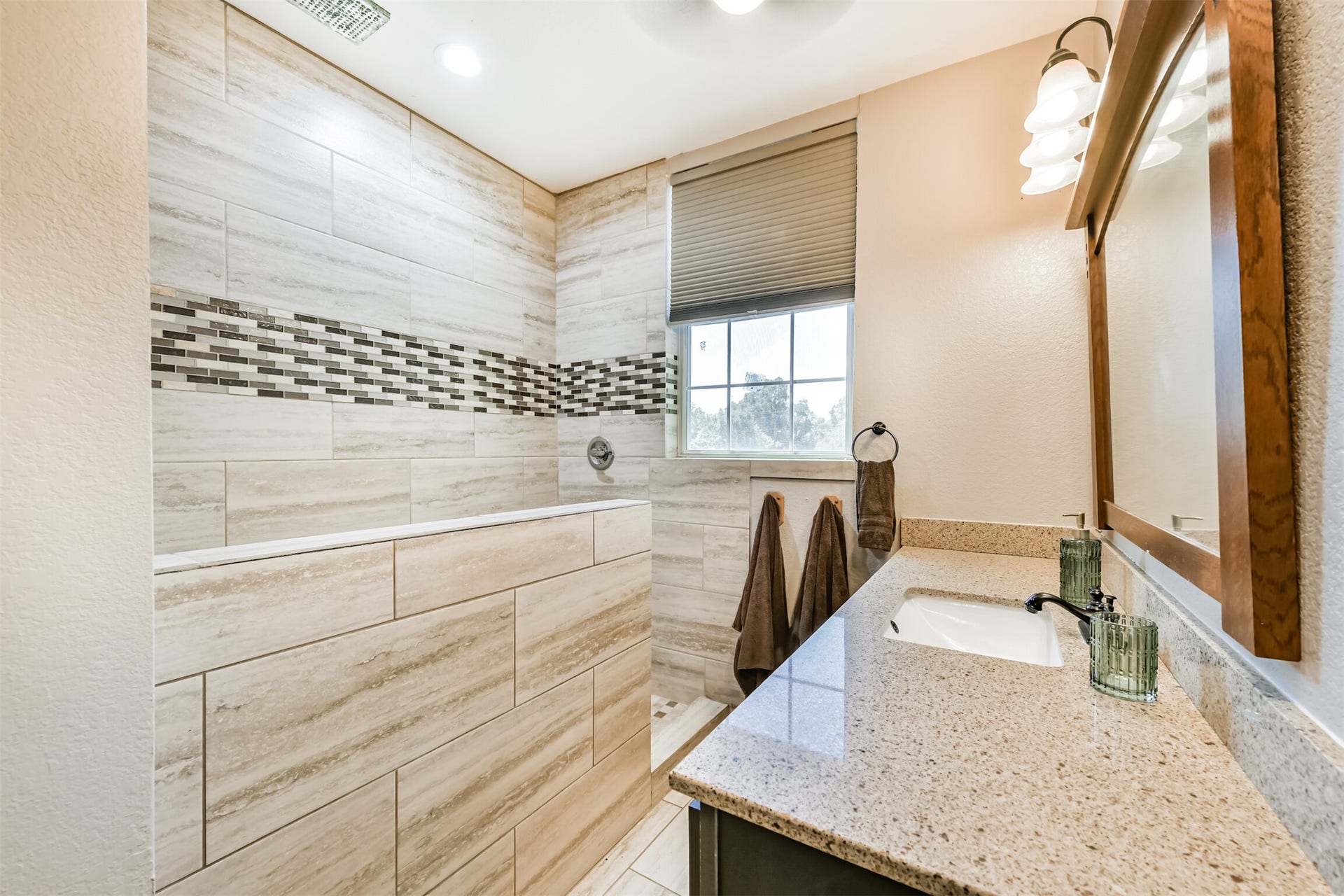 503 W Blum Street, Alvin, TX 77511 Beautifully remodeled full bath pairs modern finishes with details that complement this historic home.