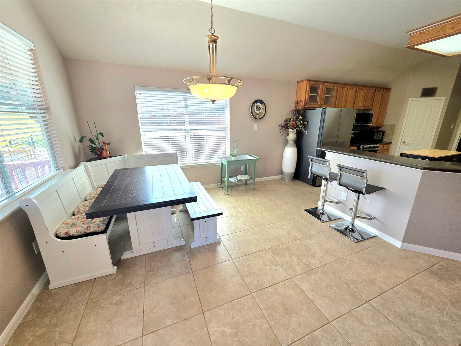 220 April Waters Drive W, Montgomery, TX 77356 Large breakfast area open to the living area and kitchen with great views outside