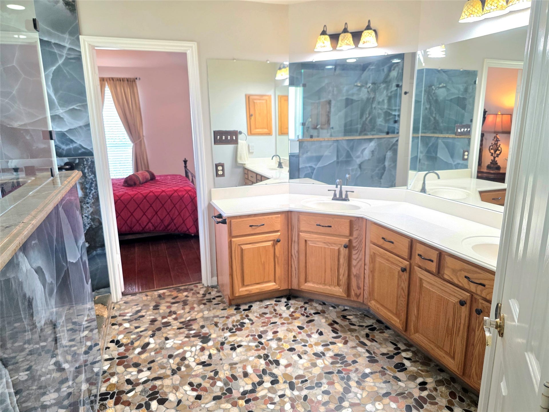 220 April Waters Drive W, Montgomery, TX 77356 Double vanity and lots of cabinets in this roomy primary en-suite