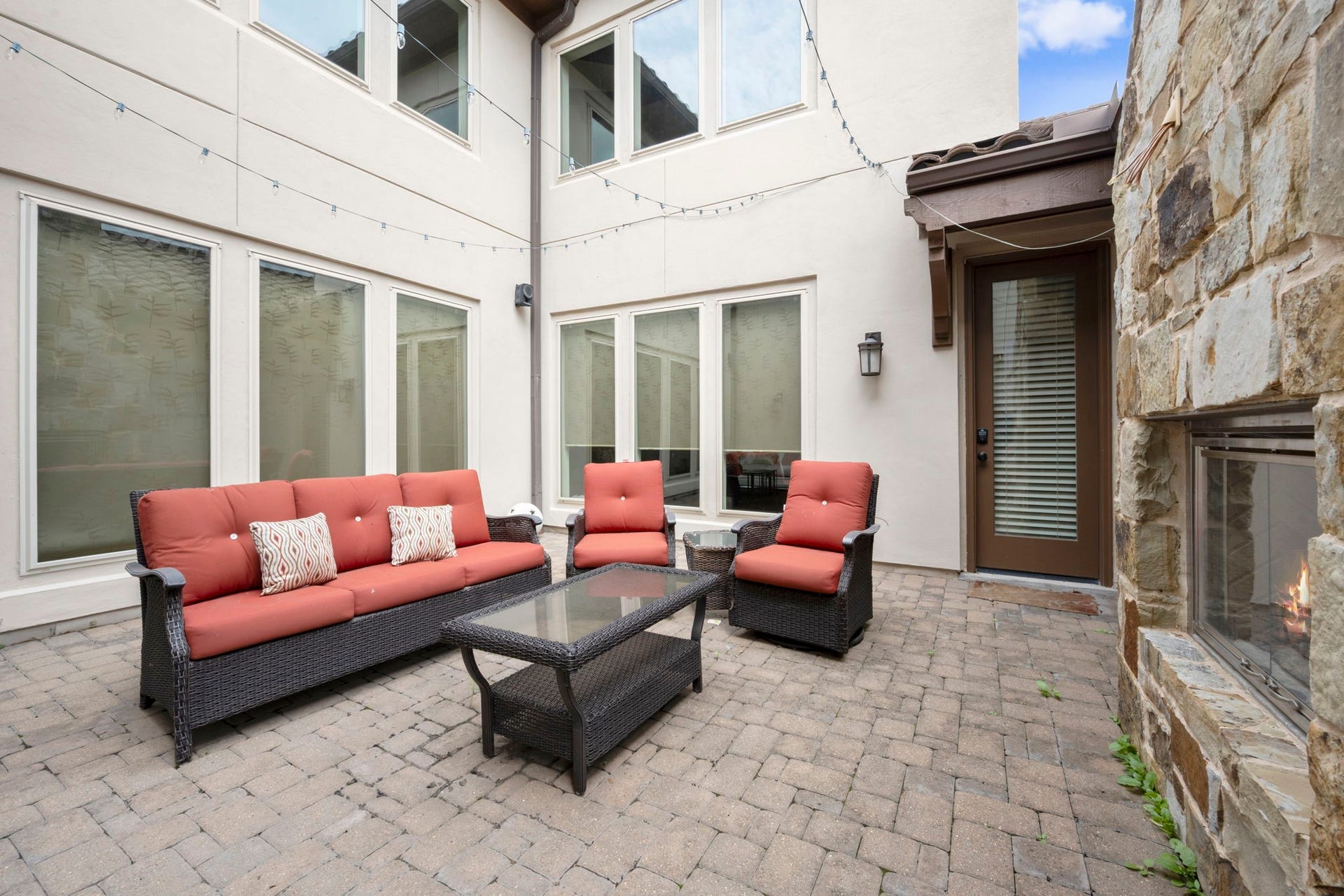 5103 Jackson Ponds Court, Sugar Land, TX 77479 One of two outdoor sitting areas. This one features a fireplace.