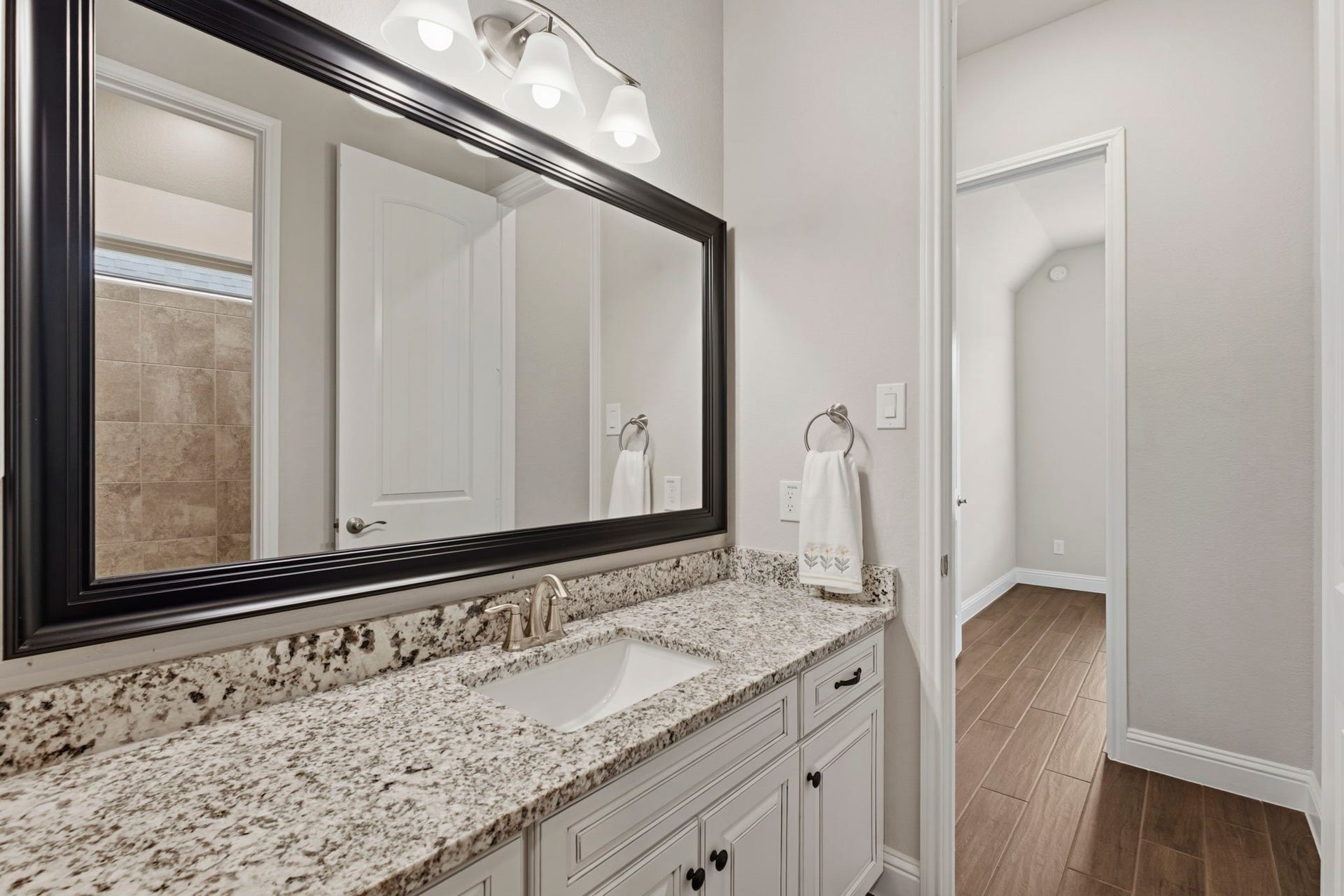 19314 Trotting Green Trail, Tomball, TX 77377 This bathroom is conveniently located between the flexroom and the secondary bedroom
