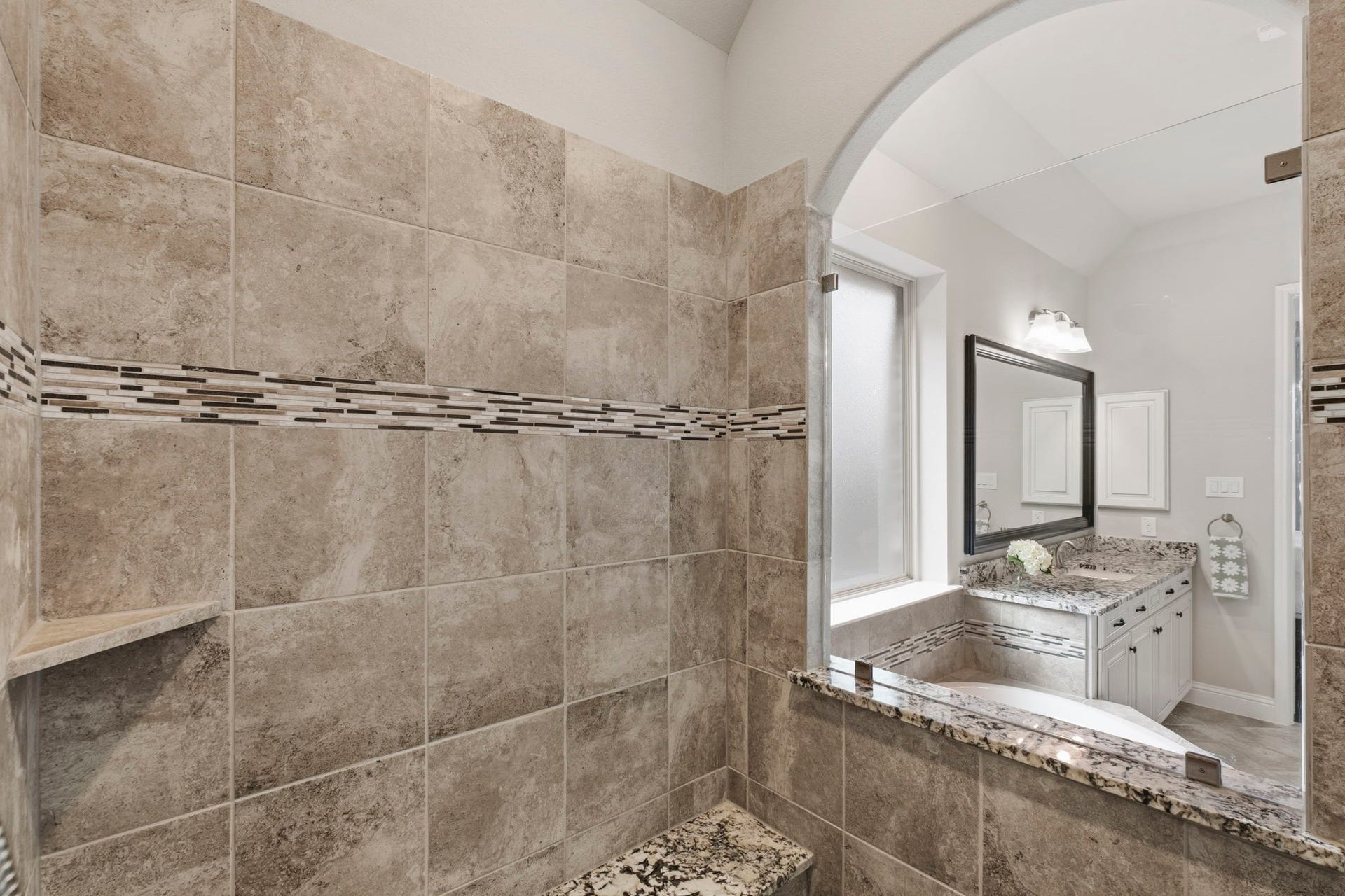 19314 Trotting Green Trail, Tomball, TX 77377 The stand alone shower with surround tile, shelve, seat and glassed in for a beautiful look