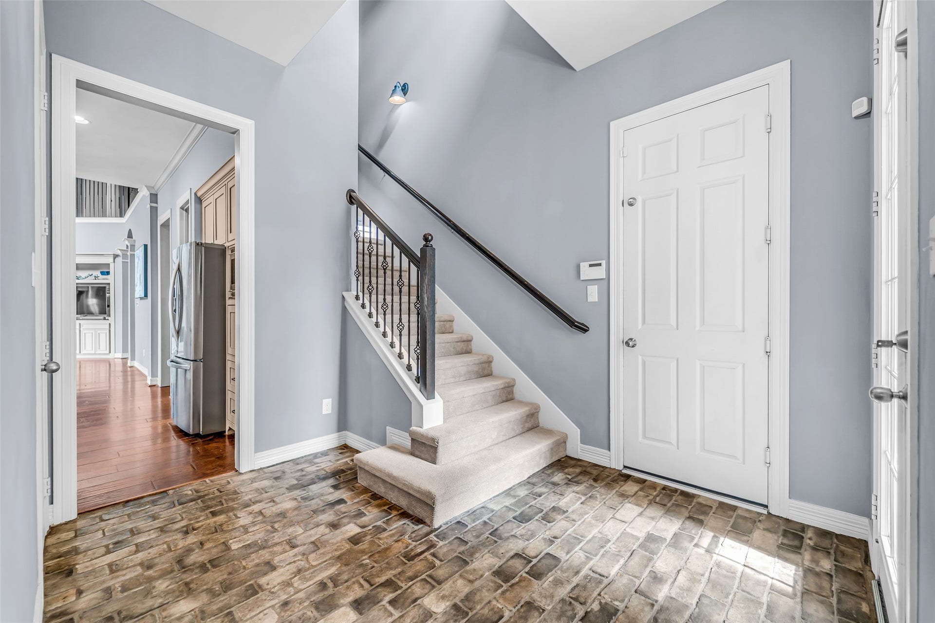 8703 Stones Throw Lane, Missouri City, TX 77459 A second staircase is tucked between the two garages at the side door entry.