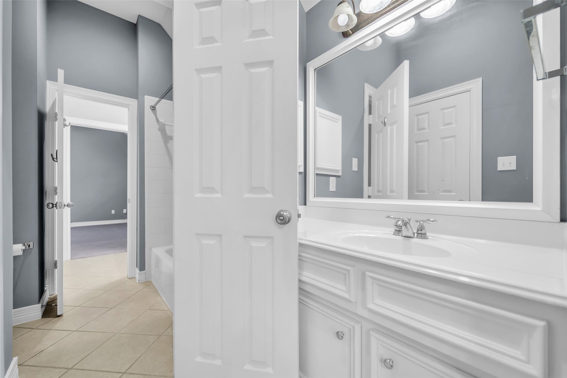 8703 Stones Throw Lane, Missouri City, TX 77459 Includes a tub-shower combo with tile surround and tile flooring.