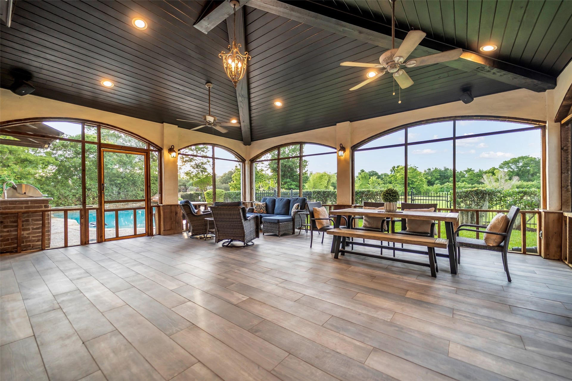 8703 Stones Throw Lane, Missouri City, TX 77459 Bonus room - one of a kind back, screened in porch! Features include tile flooring, tongue and groove wood ceiling, chandelier, recess lights, fans, TV and speakers.