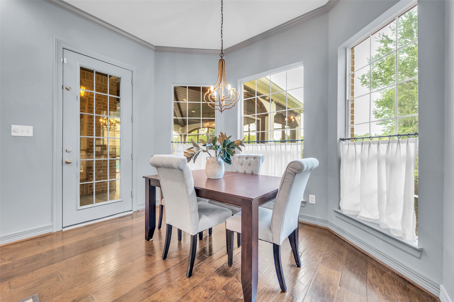 8703 Stones Throw Lane, Missouri City, TX 77459 A breakfast nook with custom chandelier, crown molding and bay windows..a peaceful place to start your day.