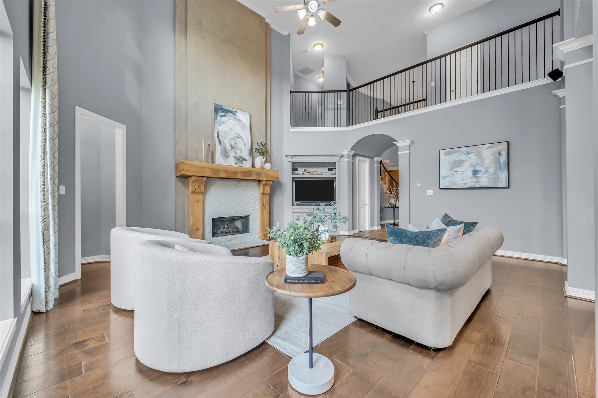 8703 Stones Throw Lane, Missouri City, TX 77459 The living room also features a brick fireplace with a custom wood mantle and hand painted over mantle.