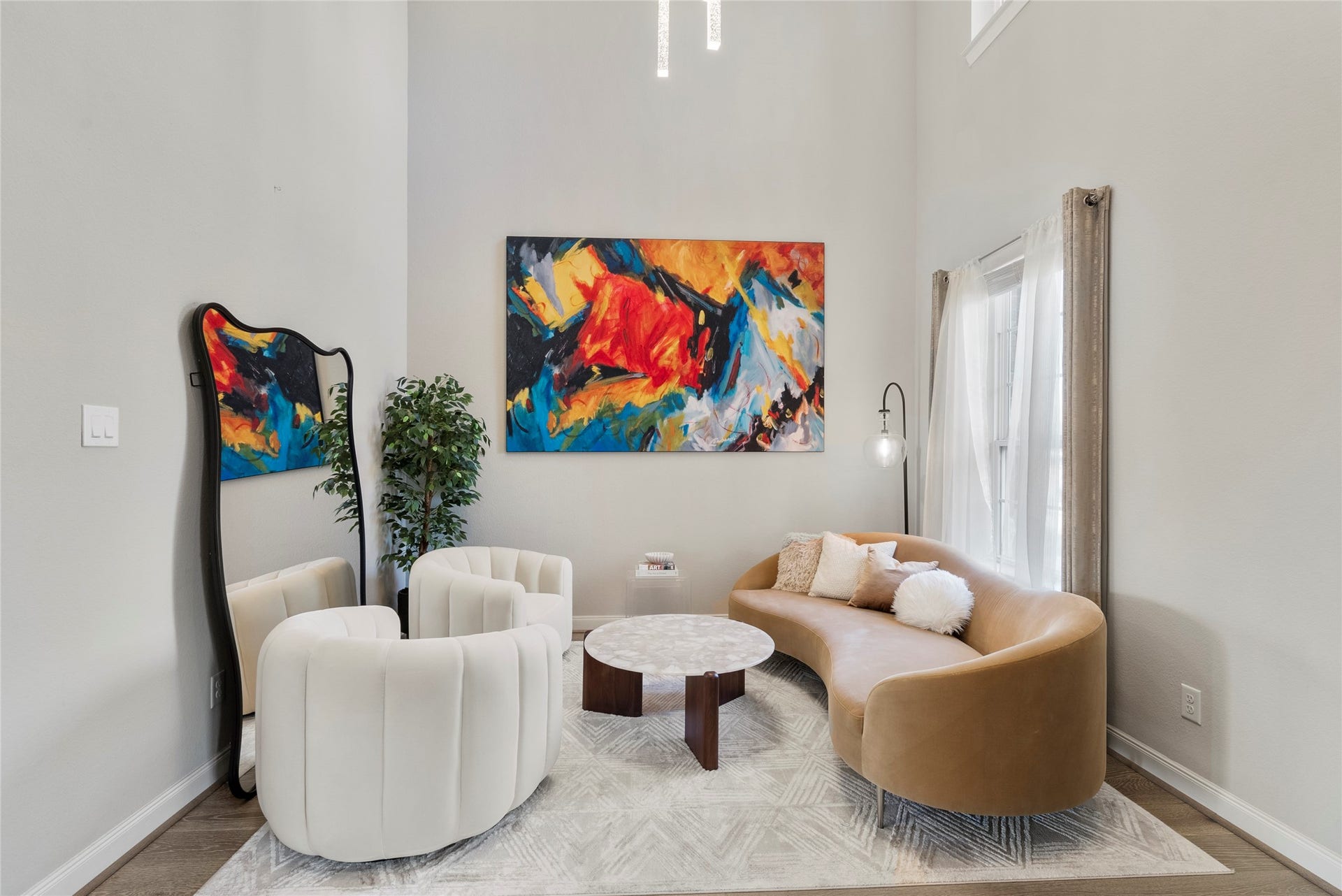 formal living used as a study with high ceiling