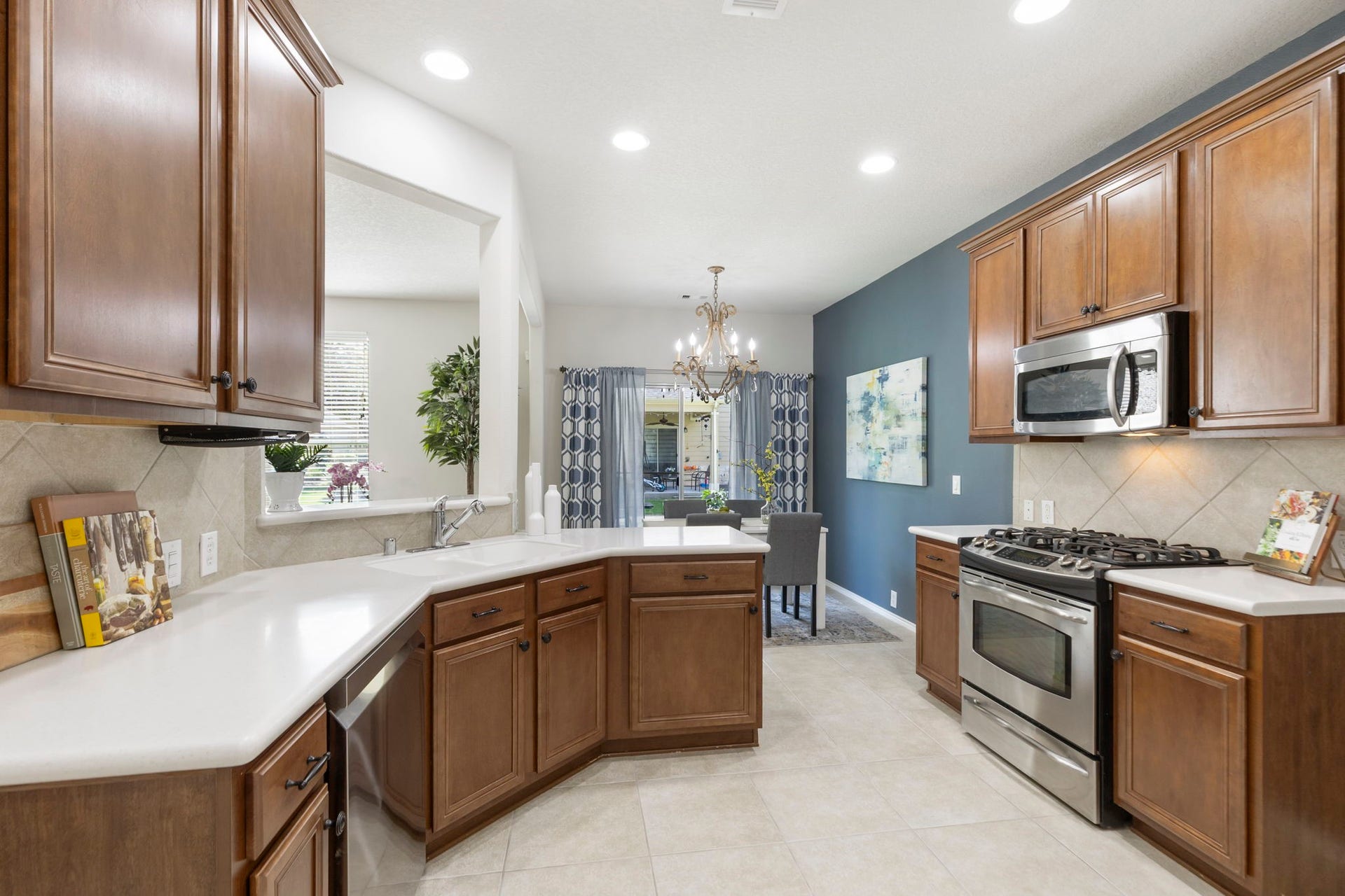 13600 Breton Ridge Street, #11A, Houston, TX 77070 The kitchen includes natural wood cabinetry with a rich finish, abundant storage and a large 5 foot deep walk-in pantry!