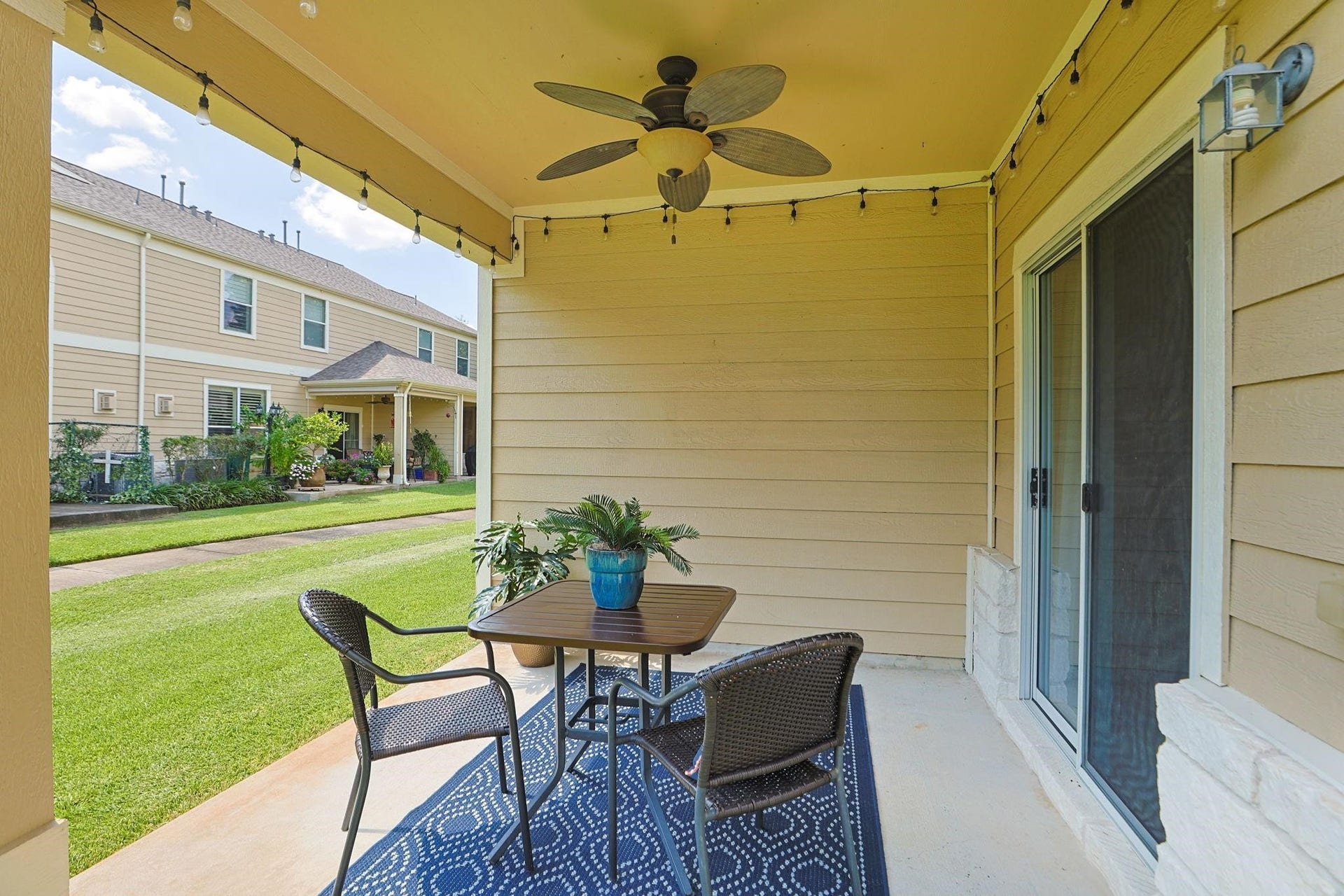 13600 Breton Ridge Street, #11A, Houston, TX 77070 The covered patio is a perfect place to unwind at the end of a busy day. The green belt provides space to stretch-out, with trails that wind throughout the community.