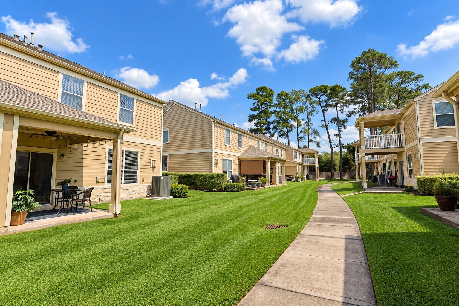13600 Breton Ridge Street, #11A, Houston, TX 77070 This charming community offers well-maintained lawns and private patios, surrounded by lush greenery and a meandering walkway.