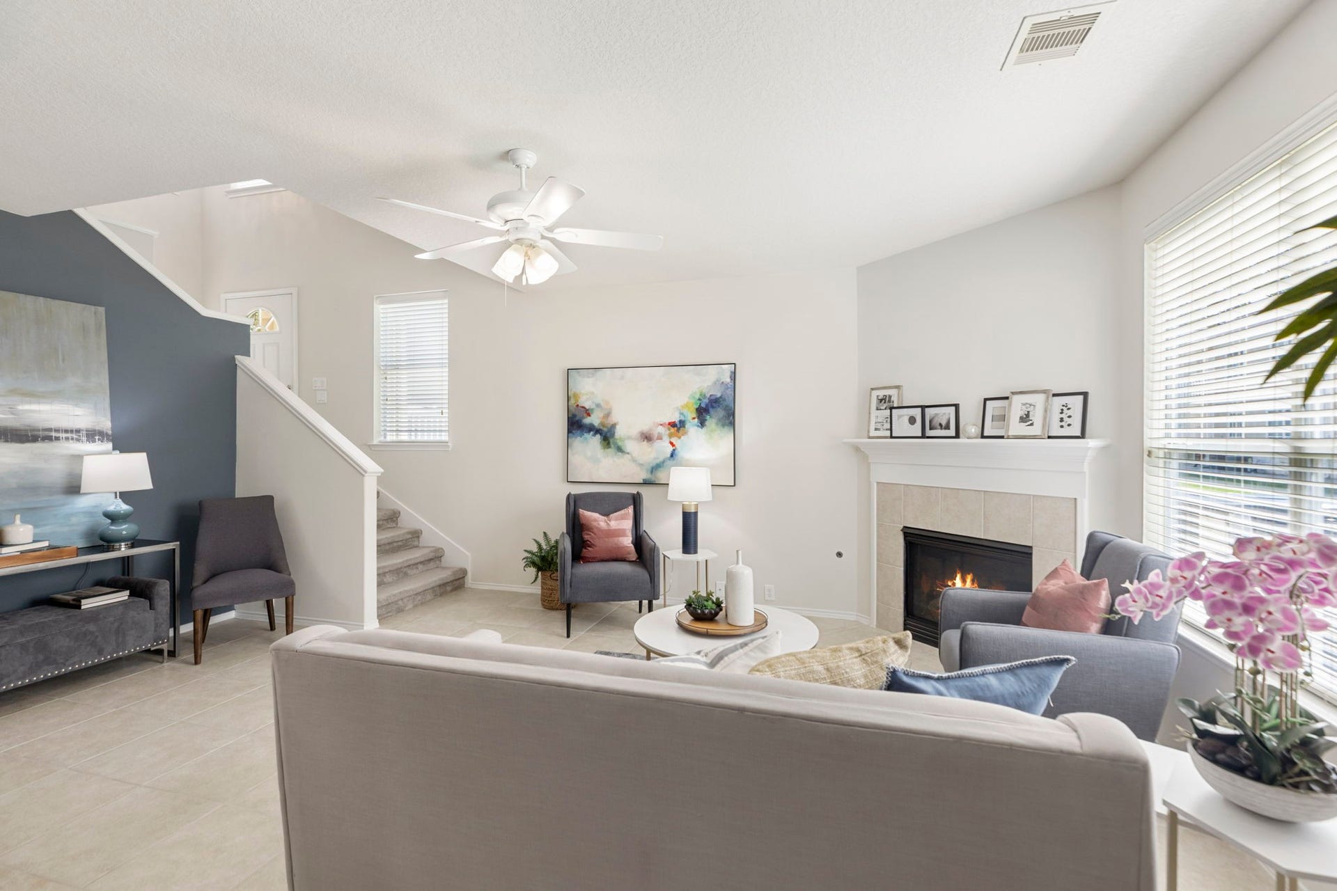 13600 Breton Ridge Street, #11A, Houston, TX 77070 The living room is bathed in natural light and offers a view of the manicured green space. This is a perfect space for relaxing or entertaining.