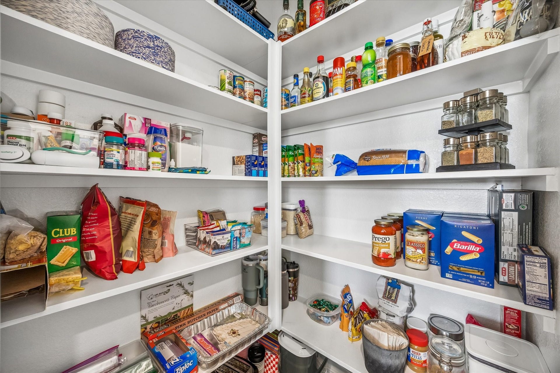 2852 Grand Anse Drive, Katy, TX 77493 Spacious pantry with wraparound shelving provides plenty or organized storage for groceries, small appliances, and kitchen essentials.