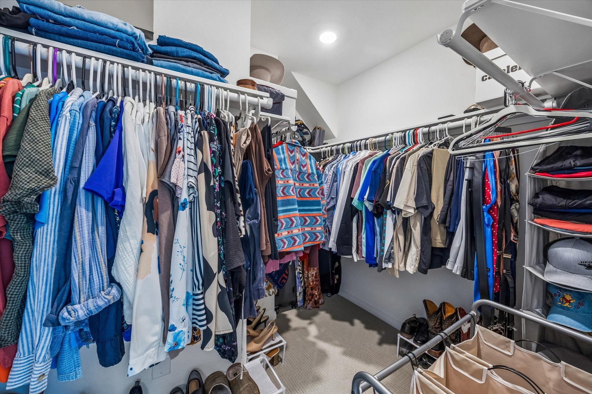 2852 Grand Anse Drive, Katy, TX 77493 Spacious walk-in primary closet offering abundant hanging space and room for additional storage and organization.