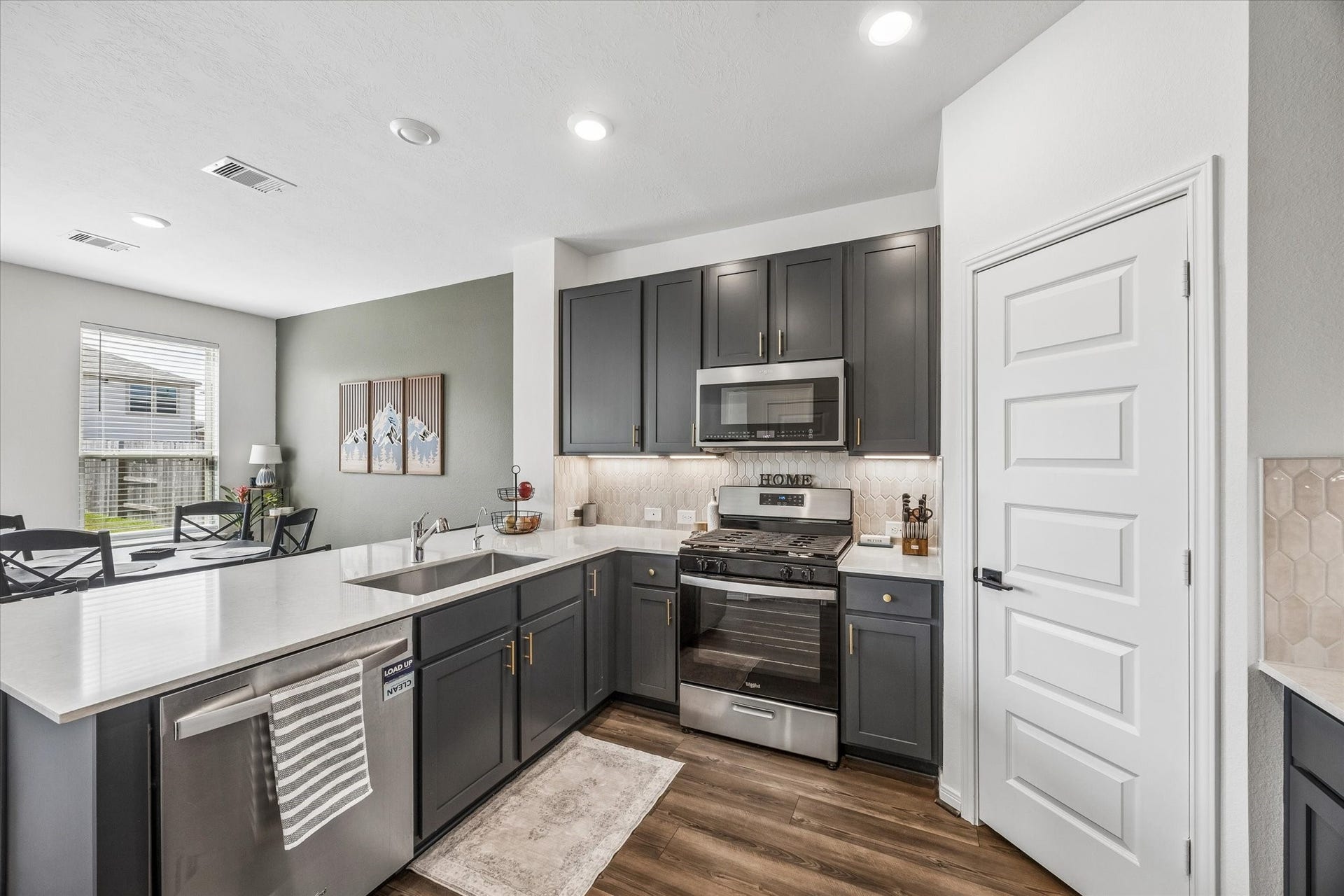 2852 Grand Anse Drive, Katy, TX 77493 Thoughtfully designed kitchen offering an efficient layout with easy access to the dining area and plenty of space for cooking and entertaining.