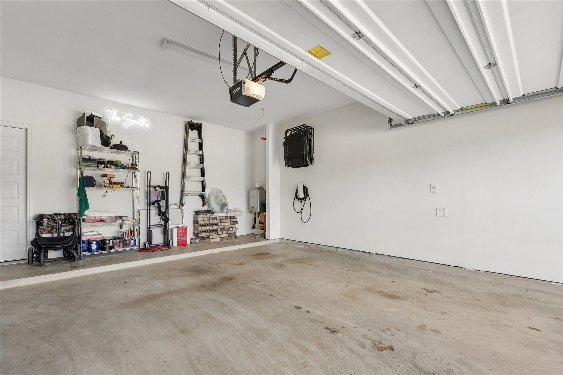 2852 Grand Anse Drive, Katy, TX 77493 Attached garage offers ample parking and storage space, plus a hardwired 48-amp EV charging connection for convenient at-home electric vehicle charging.
