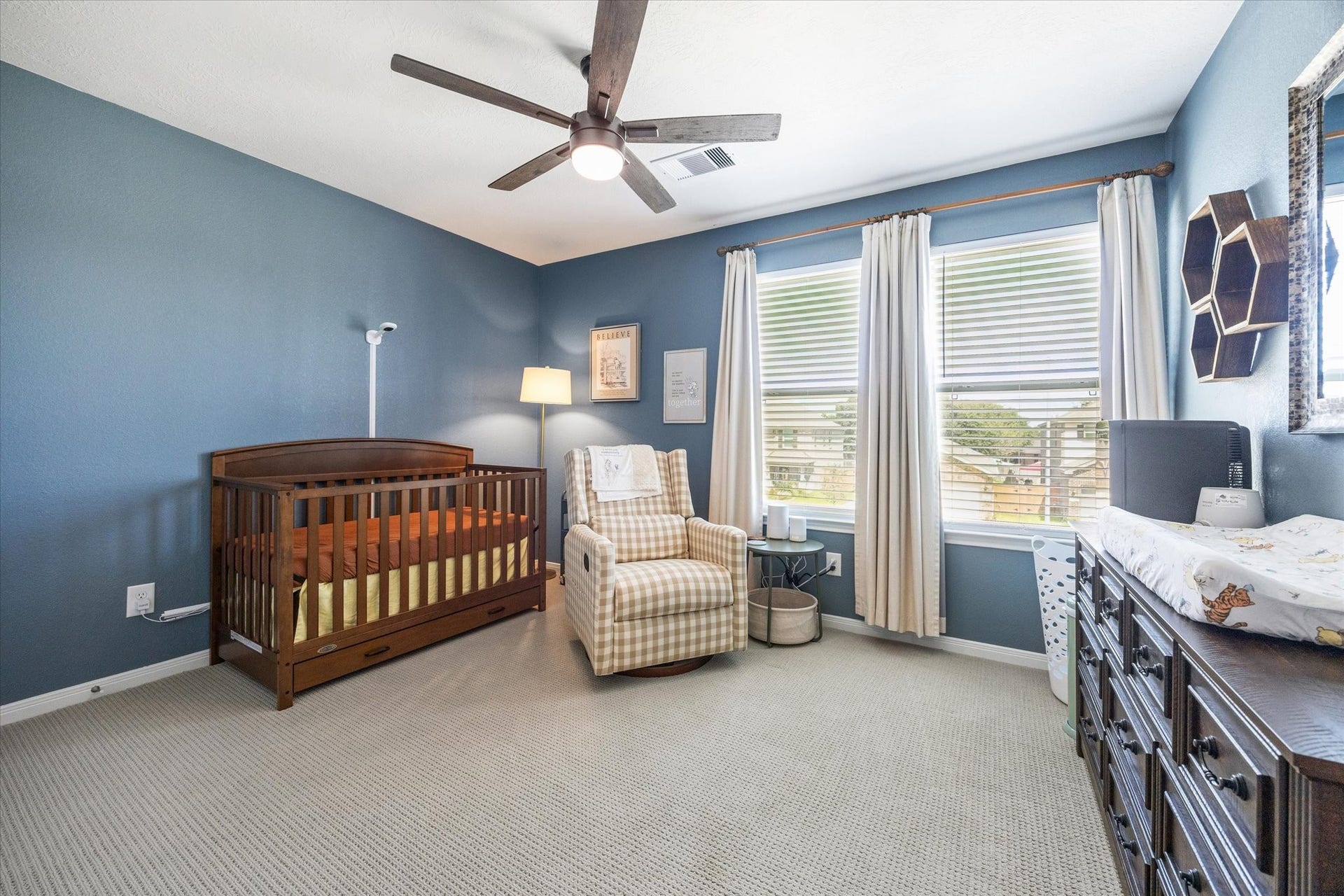 2852 Grand Anse Drive, Katy, TX 77493 Spacious secondary bedroom filled with natural light, featuring a ceiling fan and plenty of room for additional furniture.
