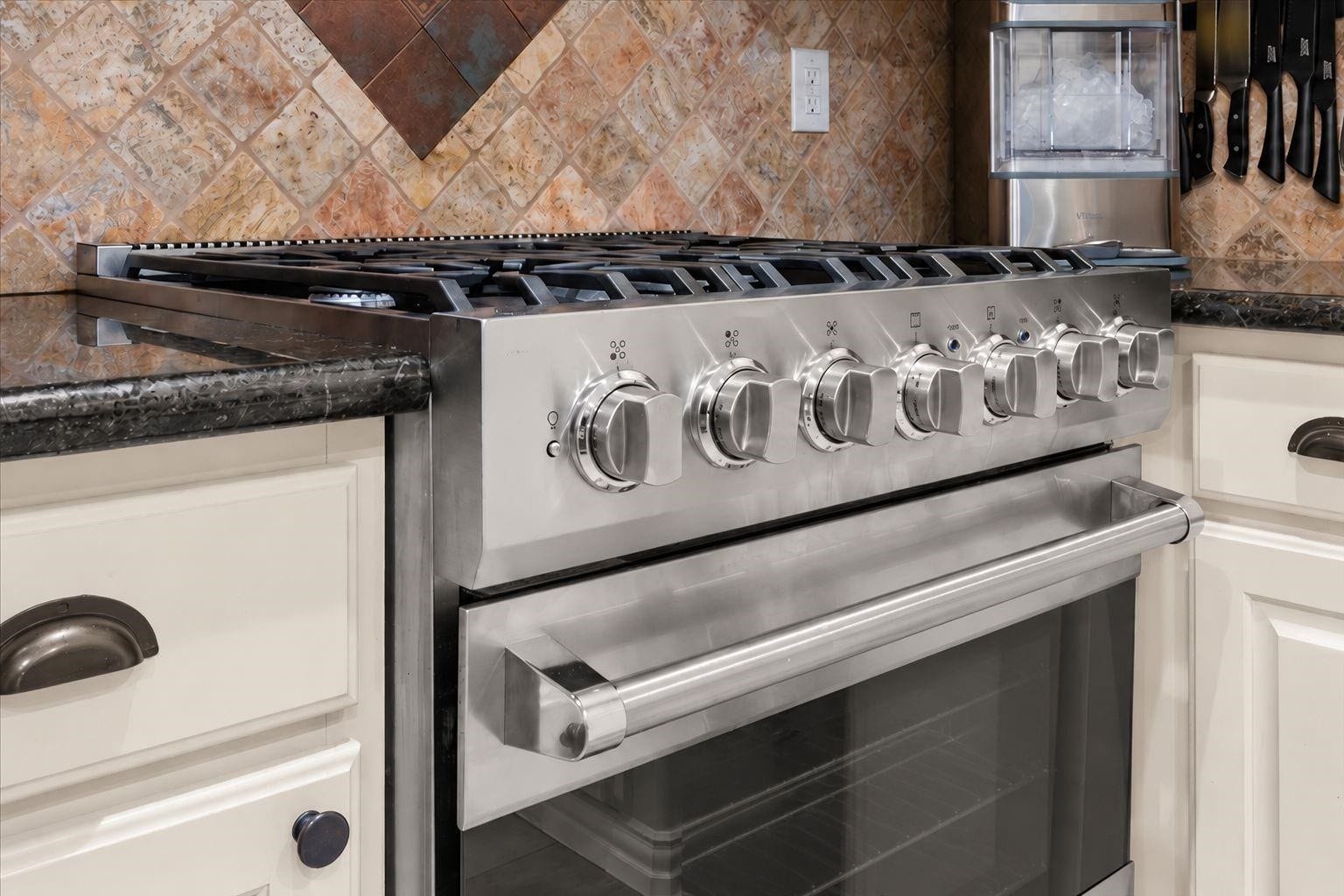2437 La Rochelle Court, Seabrook, TX 77586 Close-up of the seven-burner Viking gas range showcases its expansive cooking surface and stainless steel design.