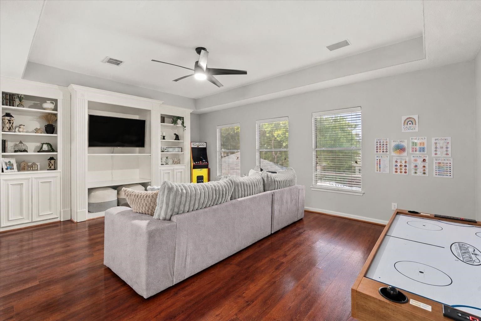 2437 La Rochelle Court, Seabrook, TX 77586 Built-in shelves and entertainment storage enhance the upstairs game room.